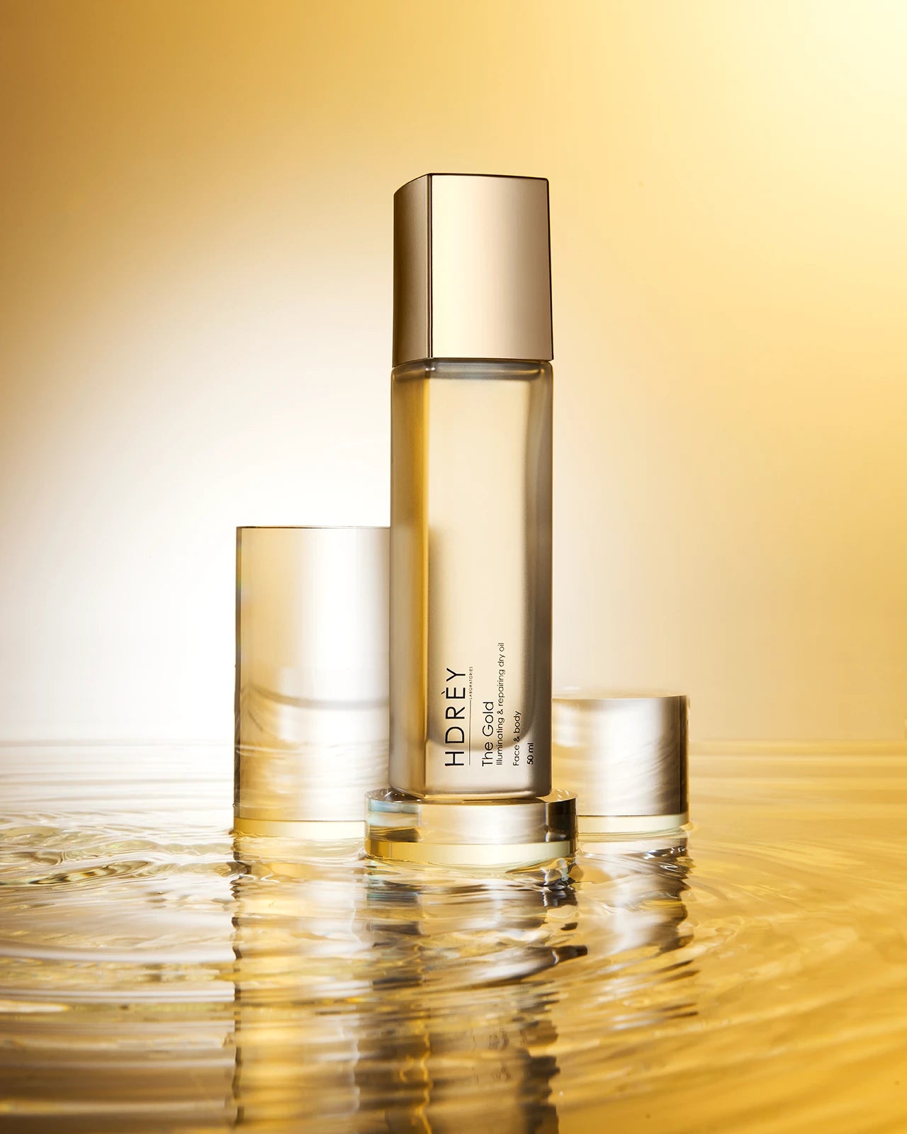 Suchy olejek liftingujący The Gold do twarzy i ciała z olejem arganowym